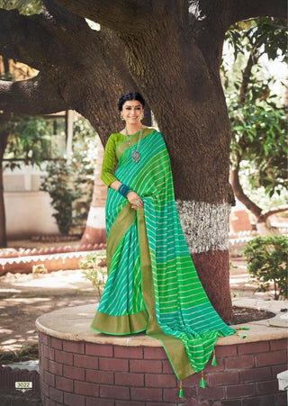 GREEN COLOR JUTE SILK  SAREE WITH fANCY COPPER BORDER  WITH TASSELS AND FANCY BLOUSE