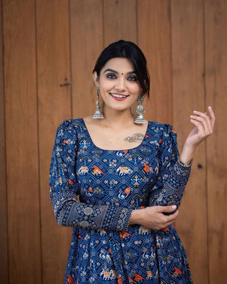 A Beautiful Blue Patola  Print Gown With full Sleeve Border